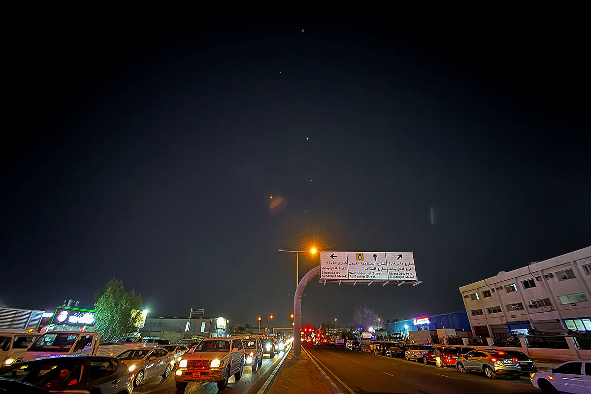 Tracers are seen in the night sky after Iran's armed forces say they targeted a U.S. base in Qatar in a missile attack.